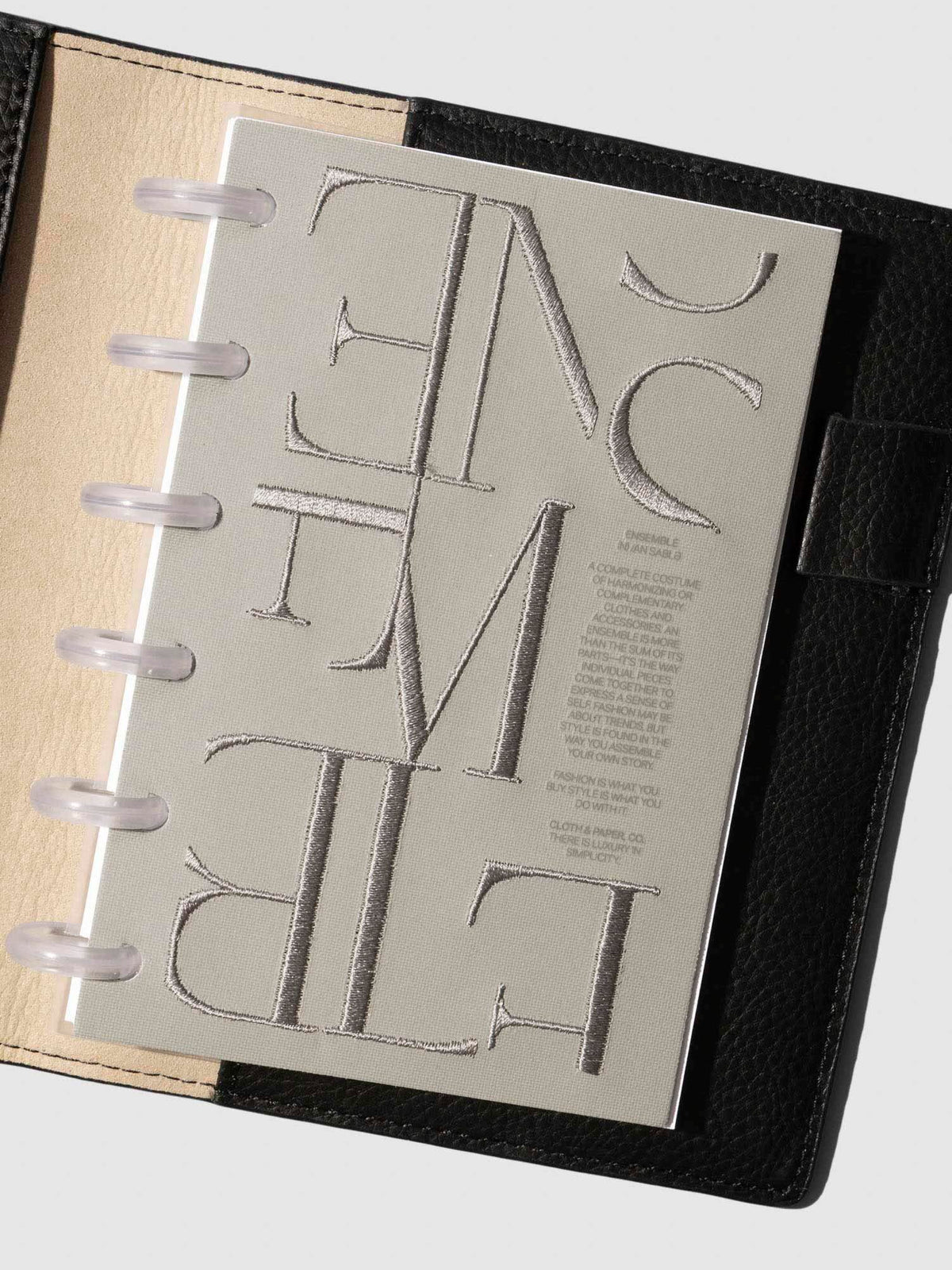 Petite Ensemble Dashboard Ristretto design shown clipped into a planner.