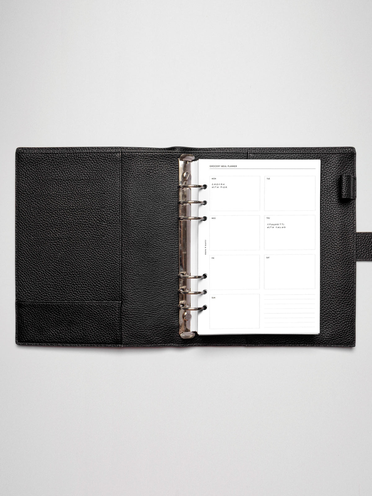 Grocery Meal Planner Insert inside an opened planner.