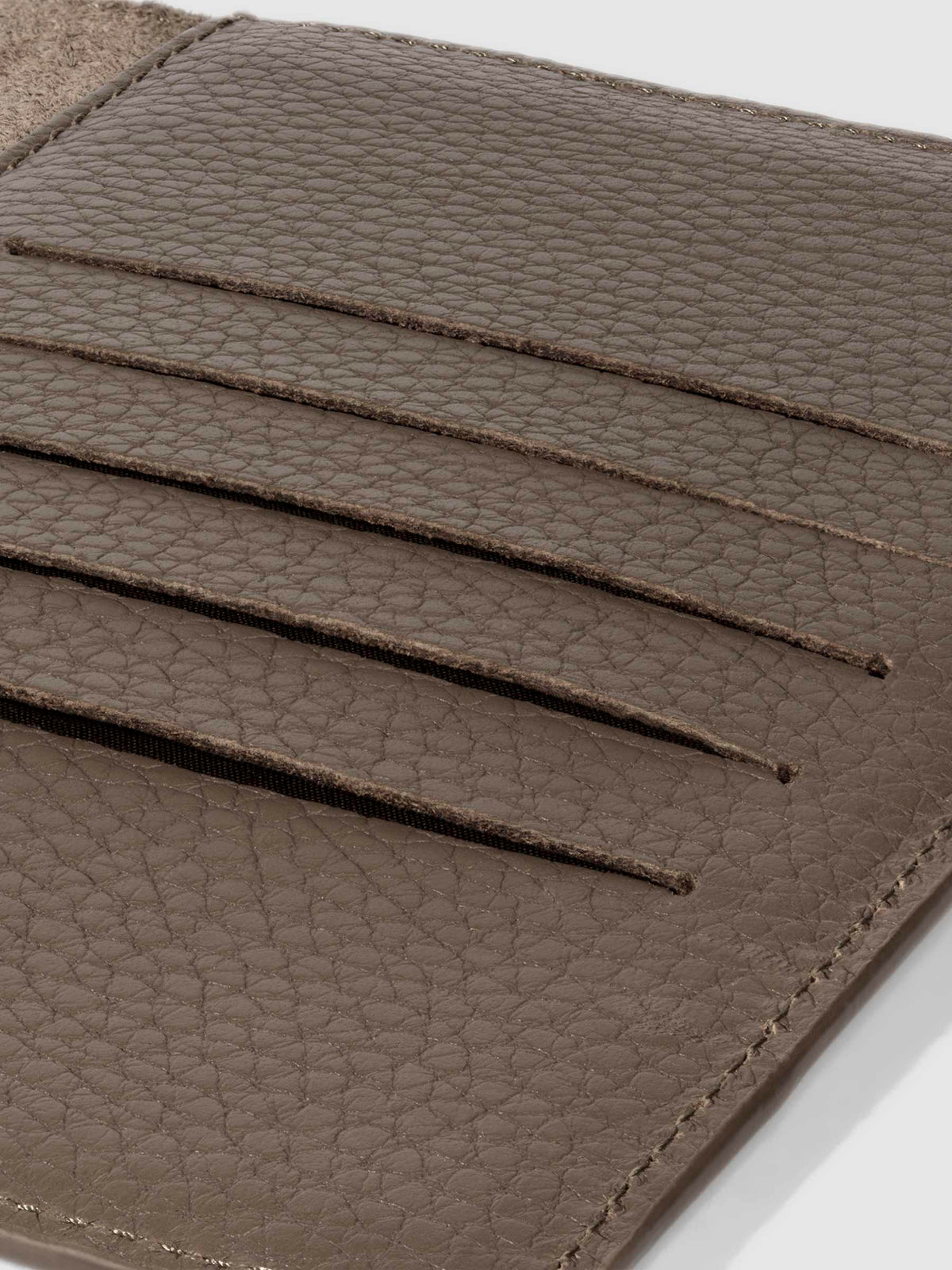 Closeup of Leon folio showing the hand-cut credit card slots.