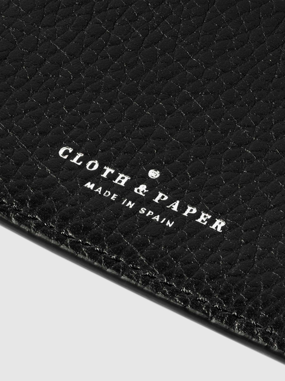 Closeup of Padrillo folio's foil-stamped Cloth and Paper Made in Spain logo.