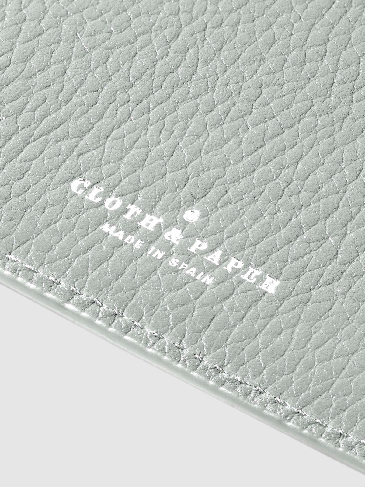 Closeup of silver foil stamp.