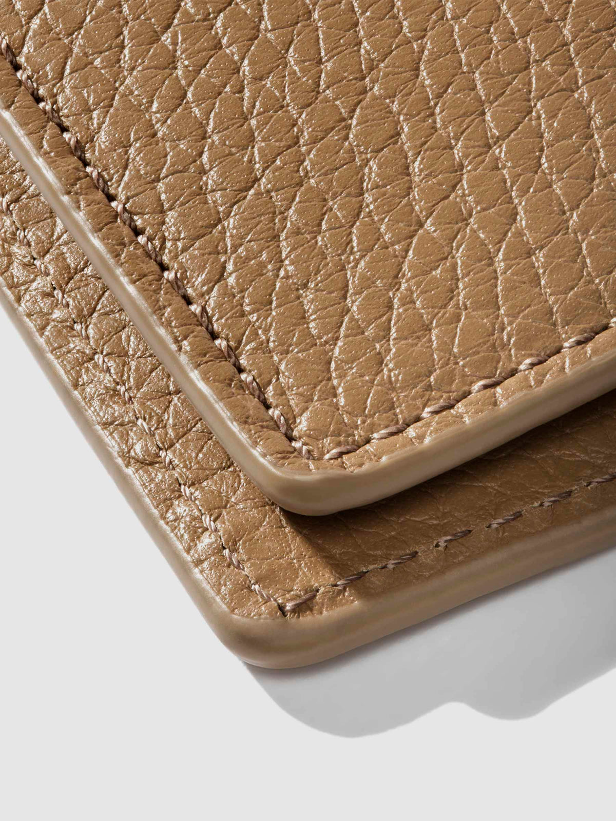 Closeup of Catalonia folio showing the stitching and glazing.
