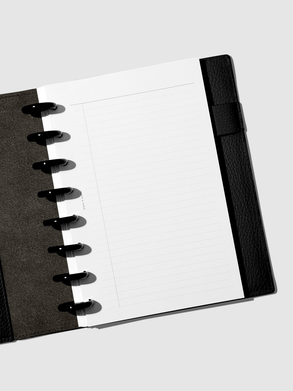 Folio displayed opened on a neutral background.