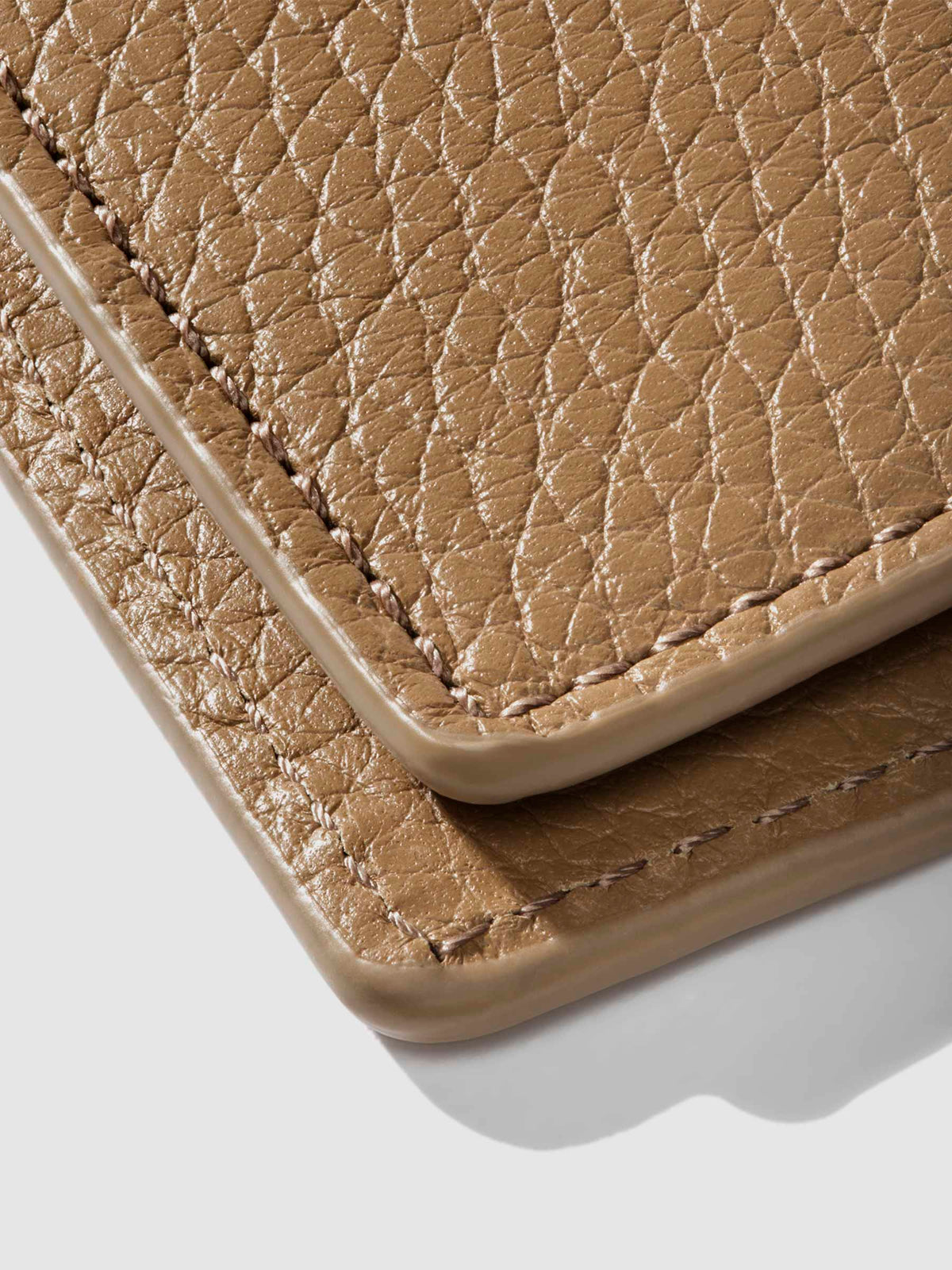 Closeup of Catalonia folio showing the stitching and glazing.
