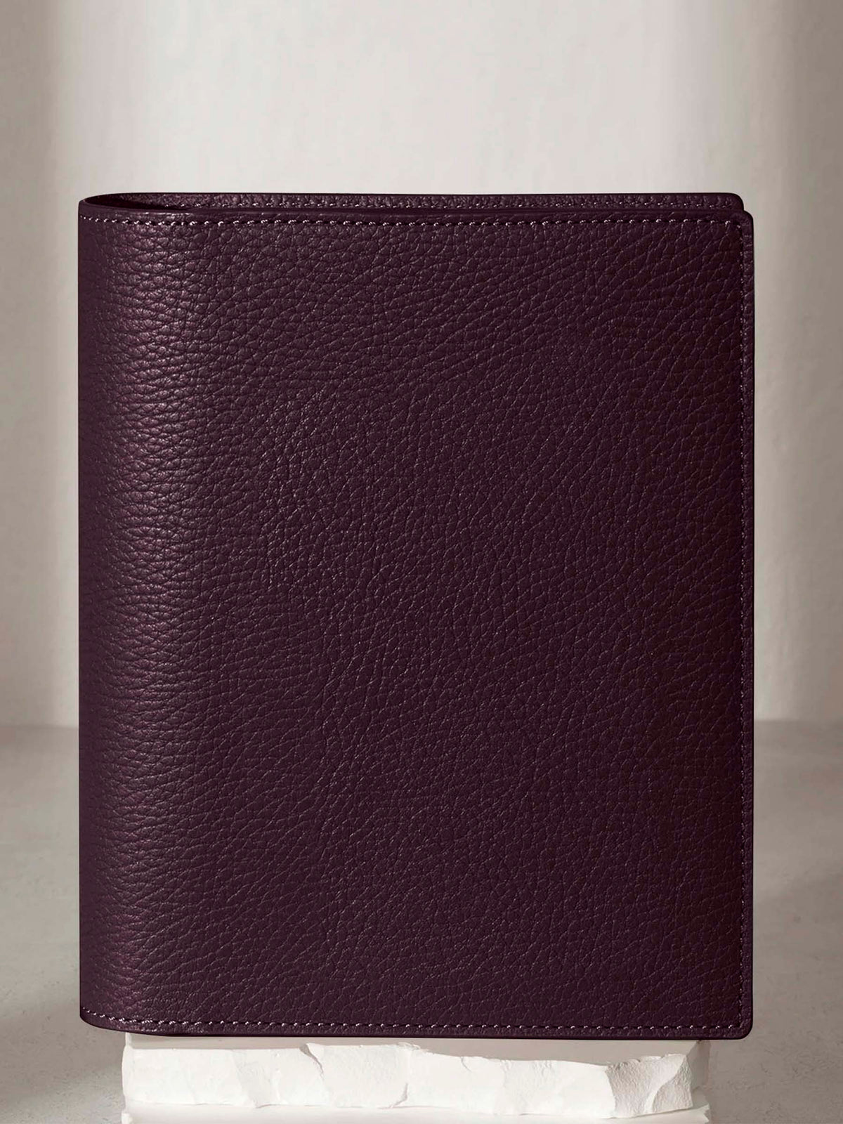 Small folio displayed on a neutral background.