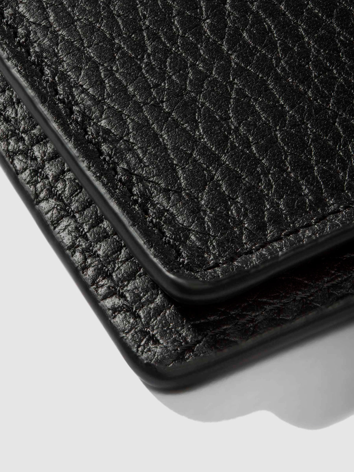 Closeup of Padrillo folio showing the hand-cut credit card slots.