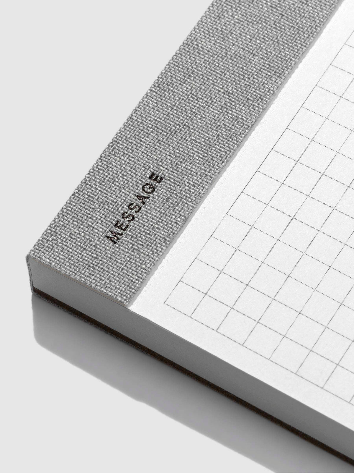 Closeup of the text on the bottom left corner of the notepad that reads "message."