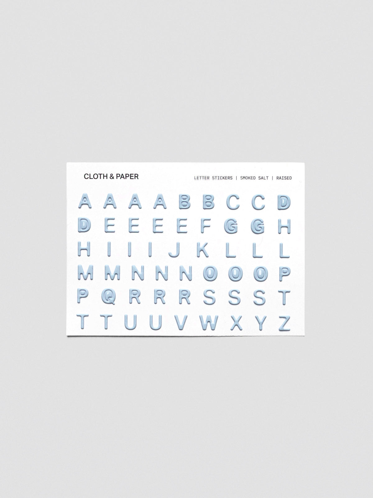 One sheet of blue grey raised letter stickers.