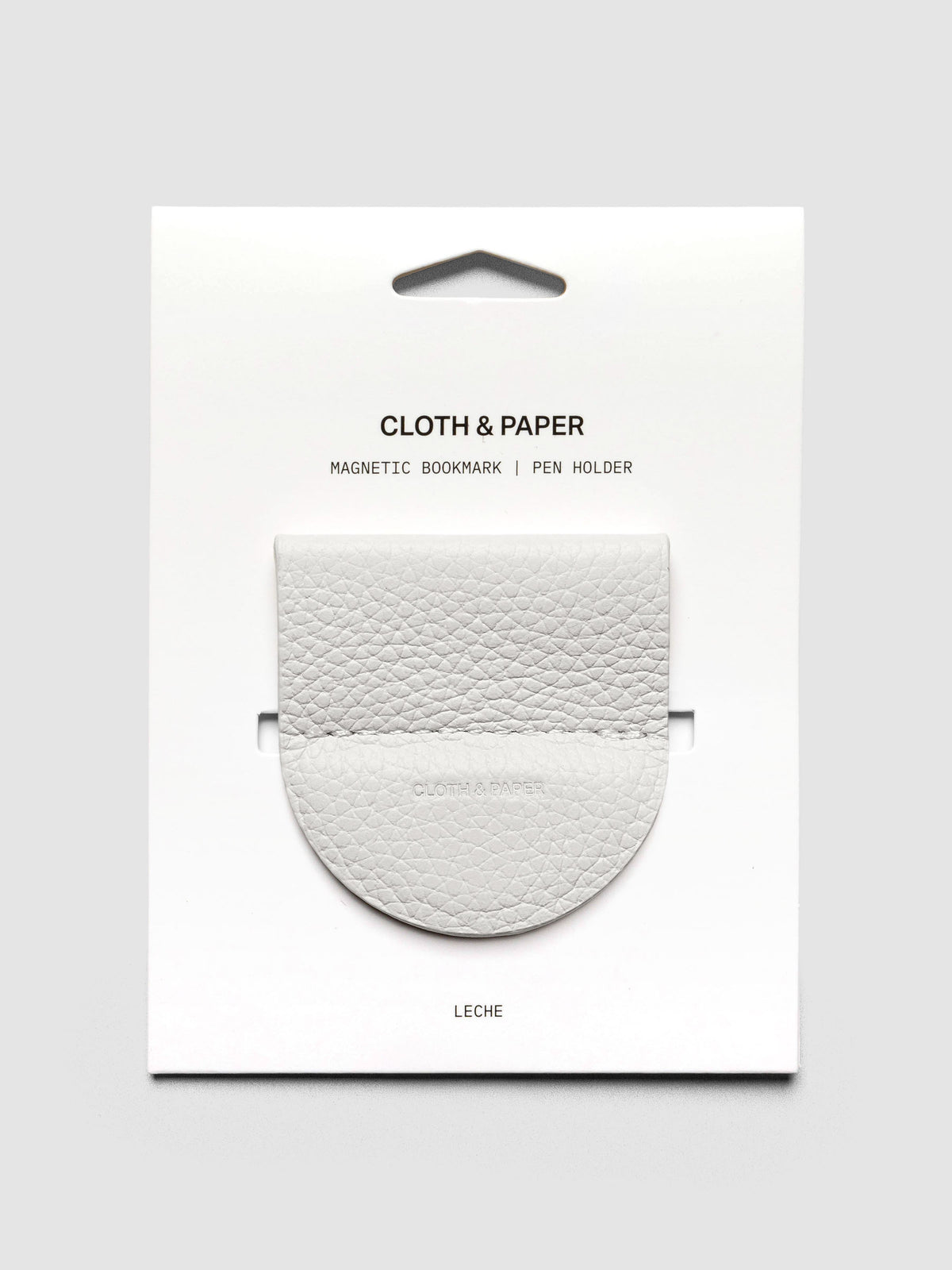 Magnetic Bookmark | Pen Holder in color Leche (white) shown in packaging.