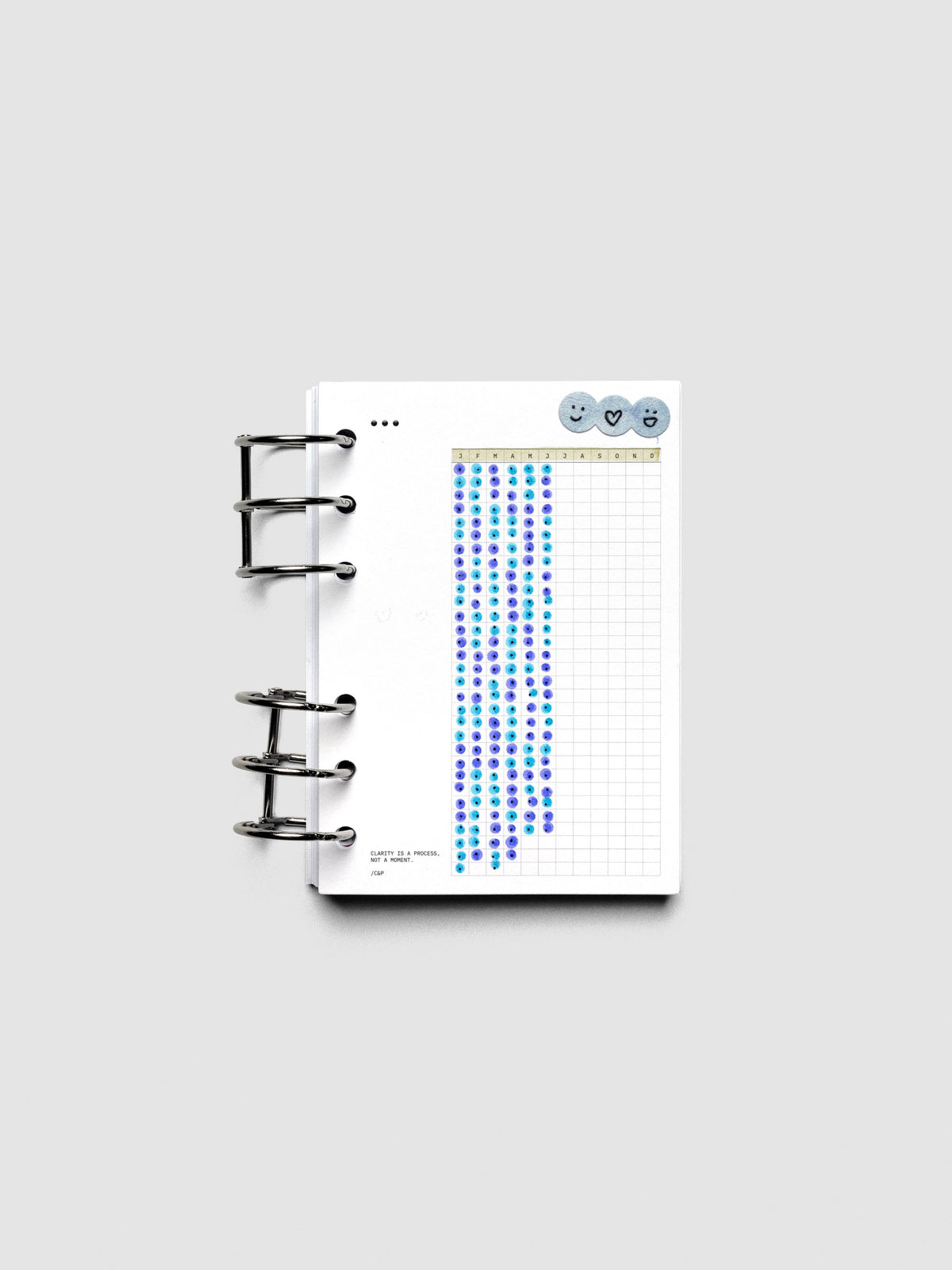 Mindful Moments Planner Dashboard in A6 size shown ring bound and filled out with various highlighters and markers.