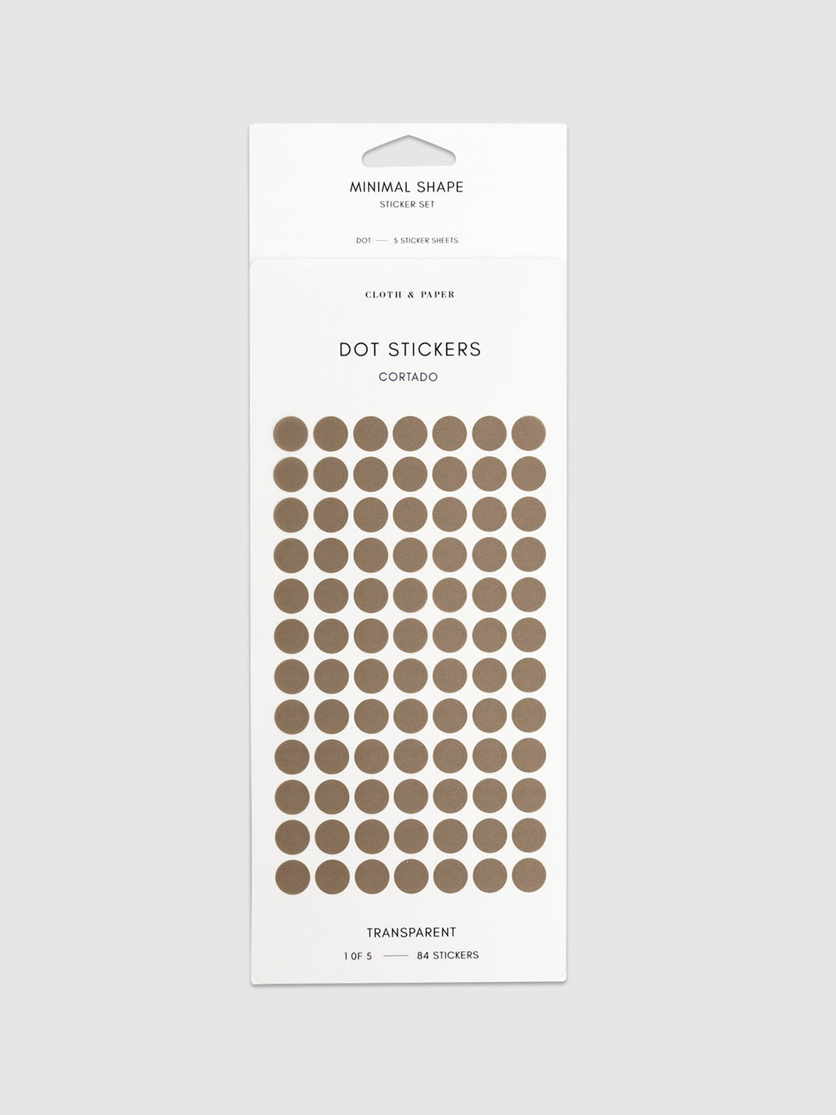 Cortado dot stickers in their packaging on a neutral background.