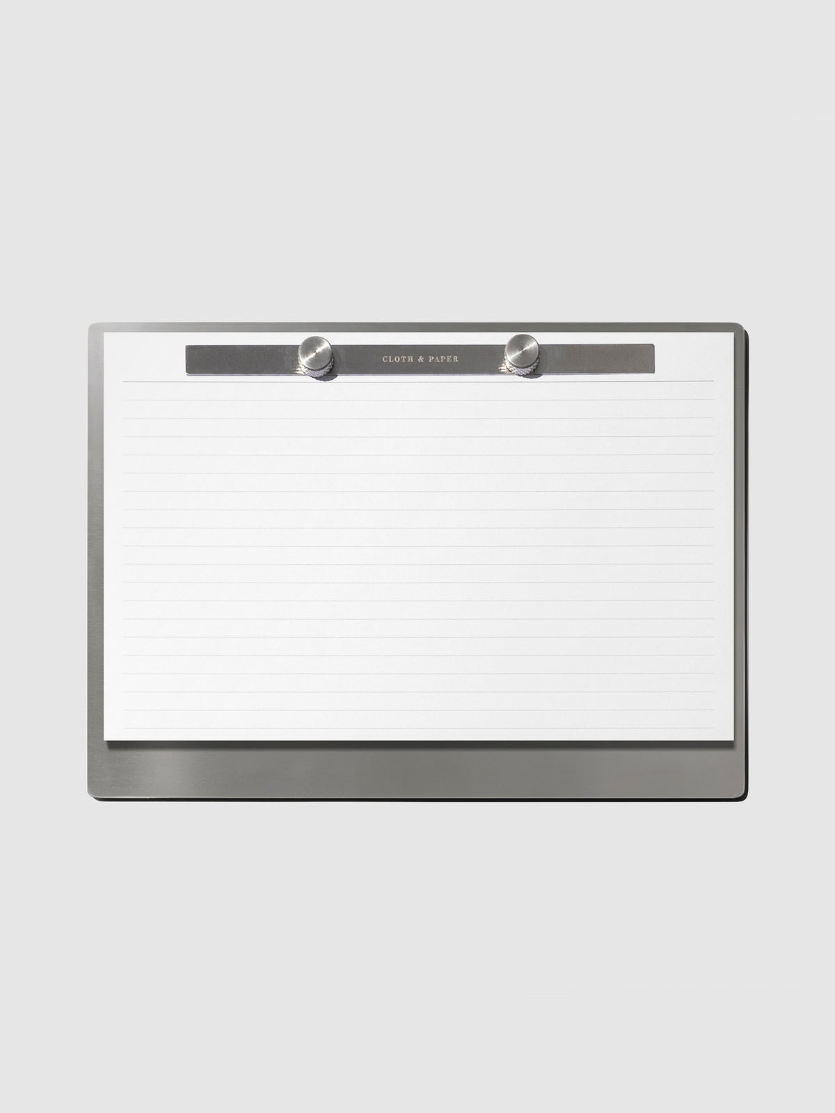 Modern Bound Notepad Insert Refills, lined, filled on the Modern Bound Notepad board, resting on a light gray background