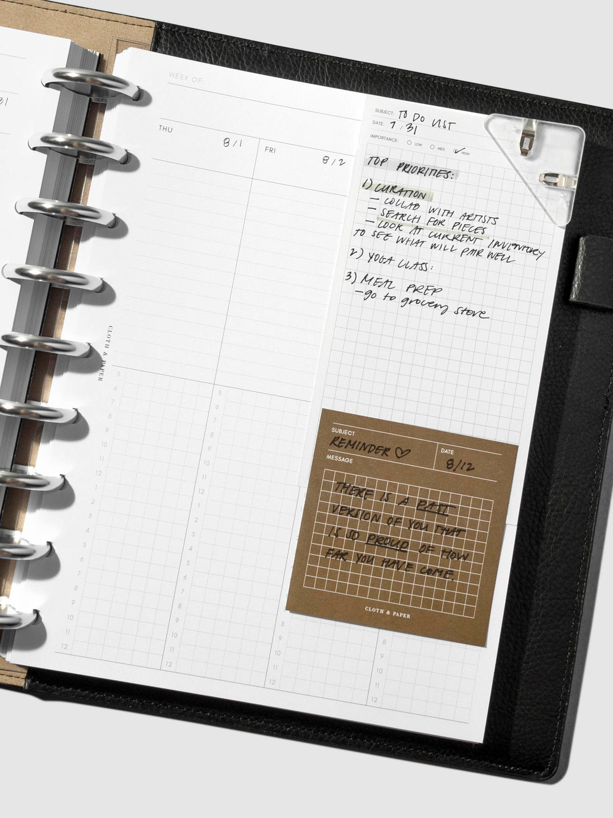 Clip shown in use inside a leather folio.