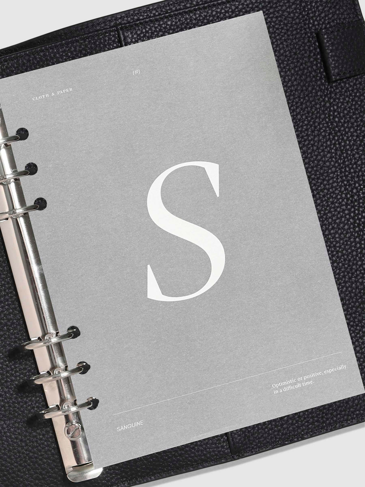 Monogram Vellum Planner Dashboard S in use in a leather planner.
