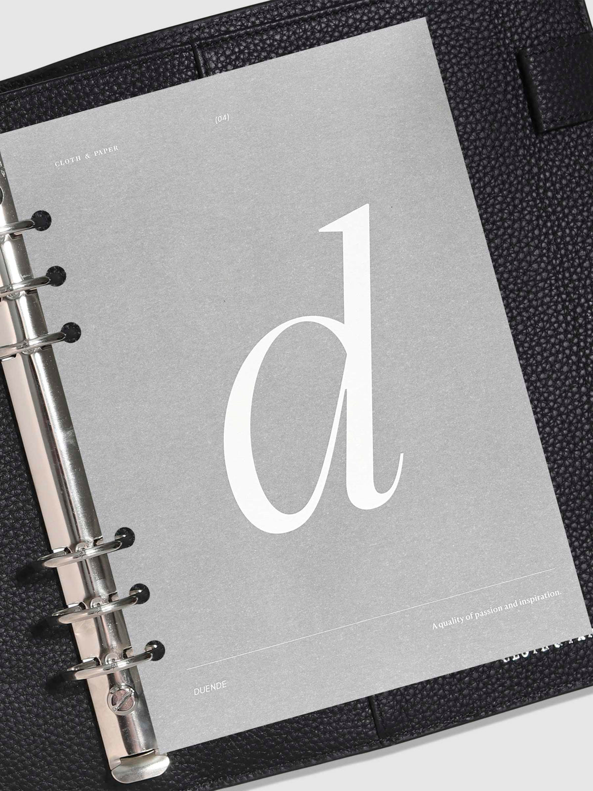 Monogram Vellum Planner Dashboard D in use in a leather planner.