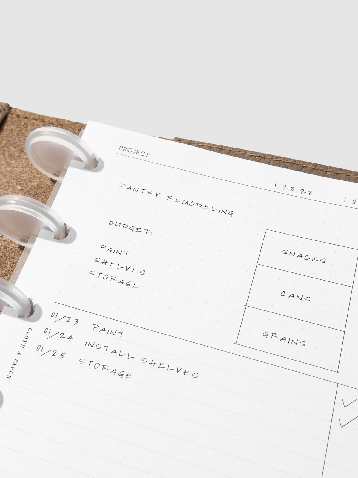 Insert in use inside a brown leather folio. Each section is filled out with sample text. Size pictured is CP Petite.
