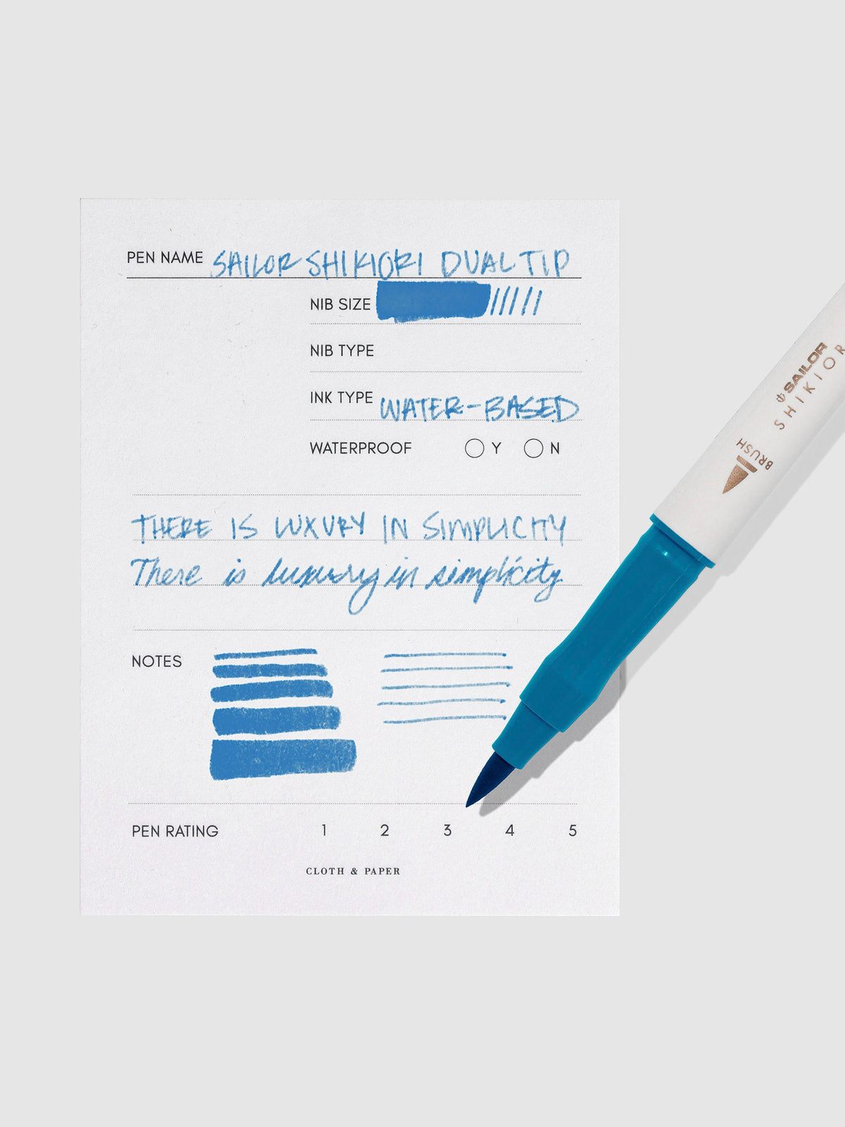 Pen displayed next to in use pen test sheet. Color pictured is Yamadori.