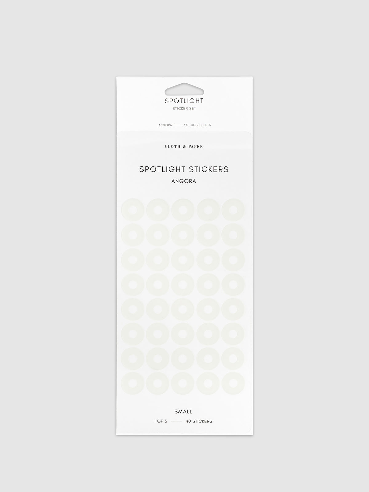 Small spotlight stickers in Angora on a neutral background.