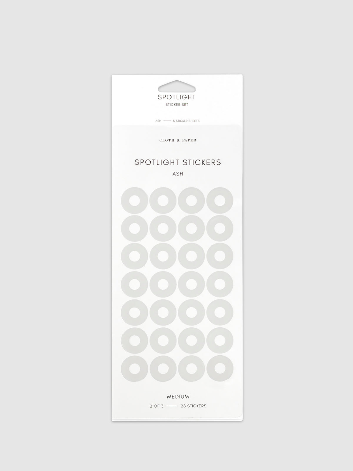 Medium sticker in its packaging displayed on a neutral background. Pictured color is Ash.