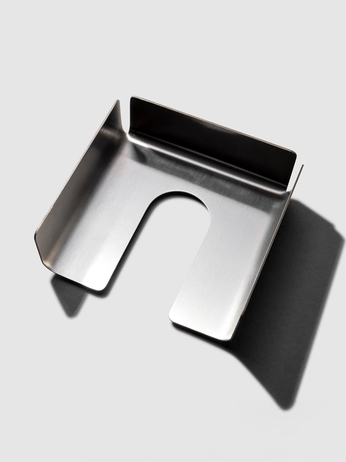 Sticky note holder displayed on a neutral background.