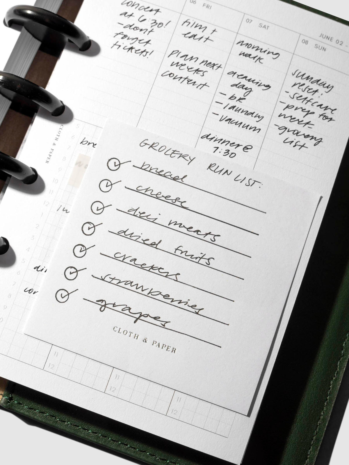 Sticky note in use inside a planner system.