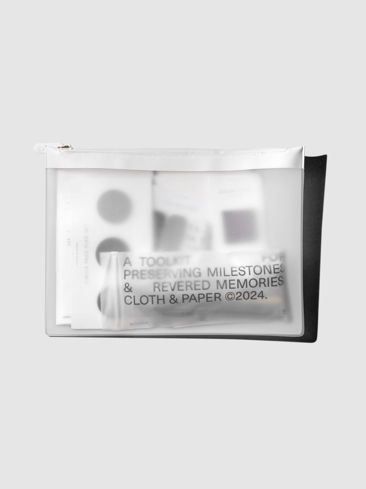 Bag shown filled with various items on a neutral background.