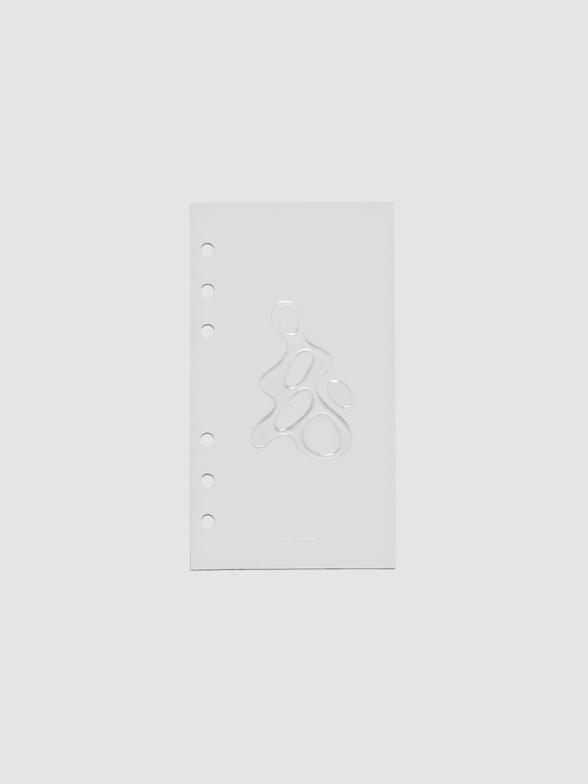 Light grey, semi-transparent, and glossy plastic planner dashboard with organic raised shape design in size Personal on a neutral background.
