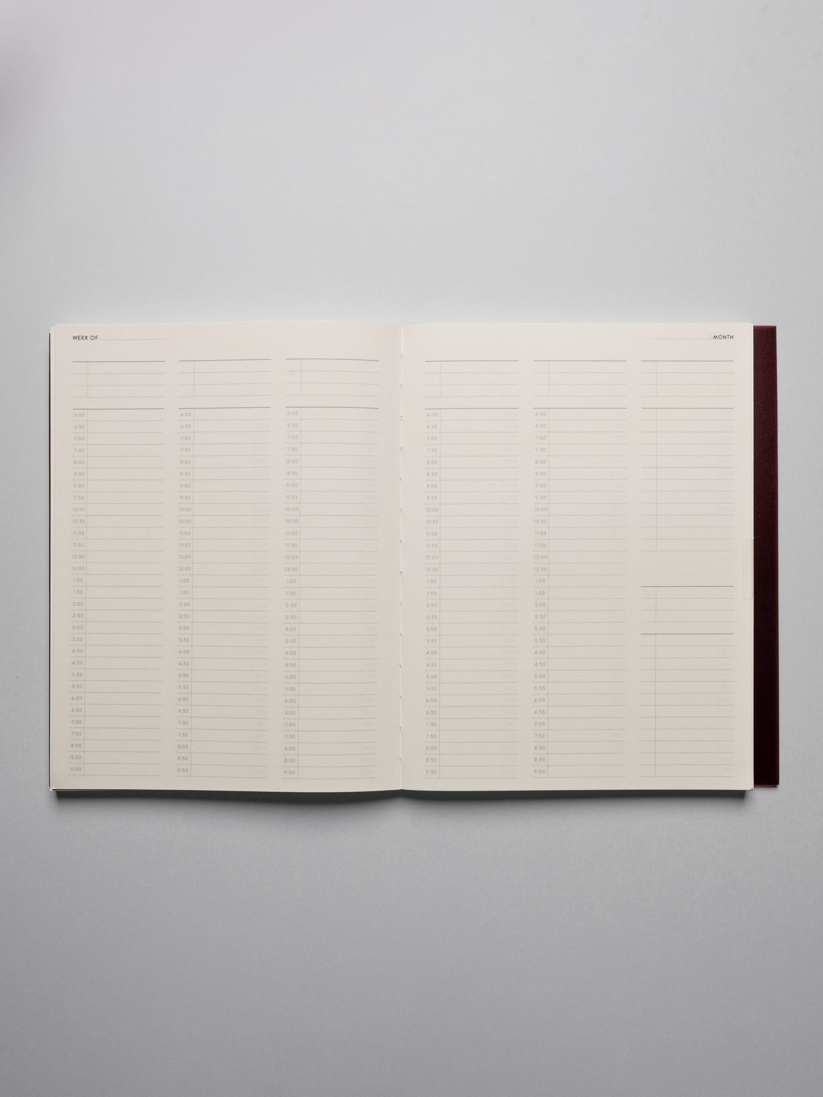 Perfect Bound Notebook in size HP Classic with 30 Minute Time Block pages shown laid flat displaying both pages for a full week's layout.