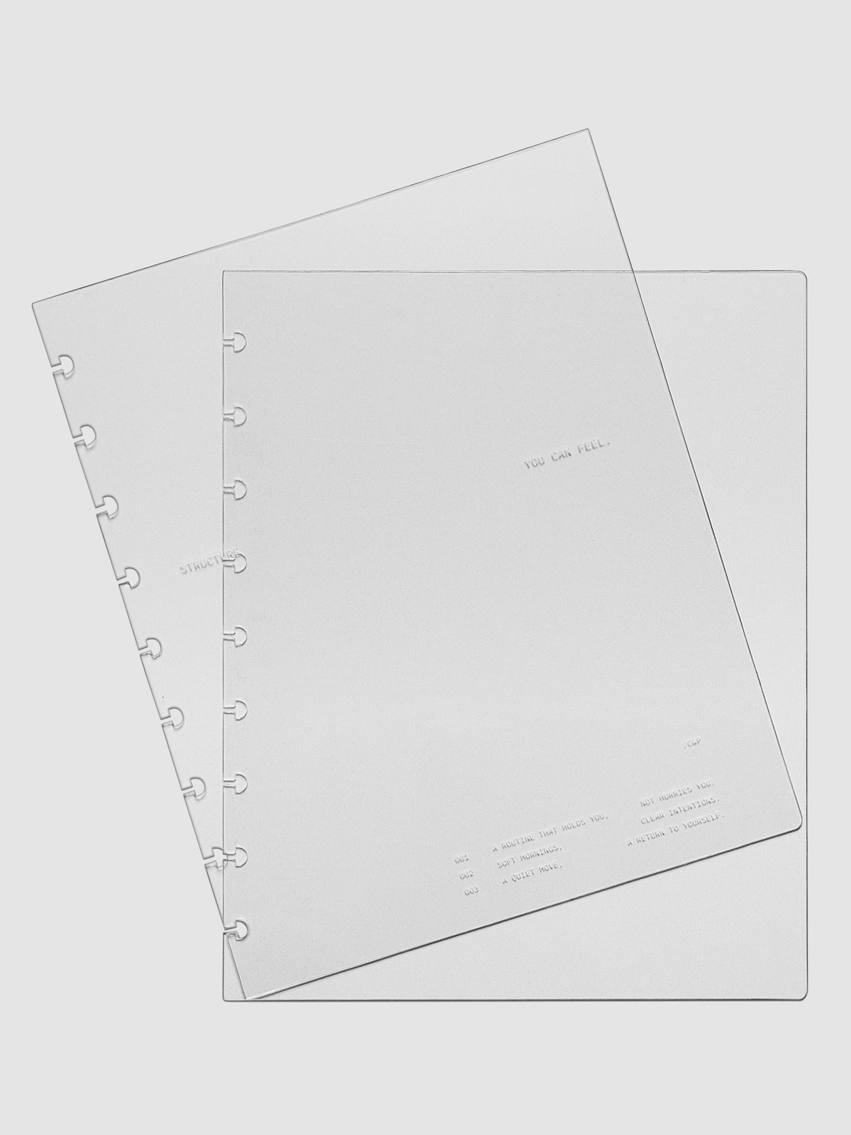 HP Classic sized crystal clear plastic planner cover set with text printed on the cover on the theme of structure and routines.