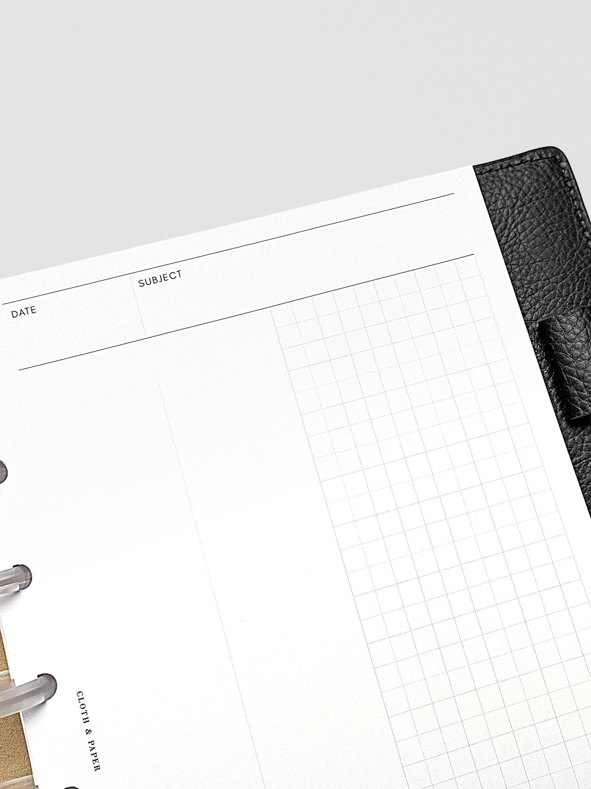 Half Letter planner insert open to show clean grid pages with flexible use.
