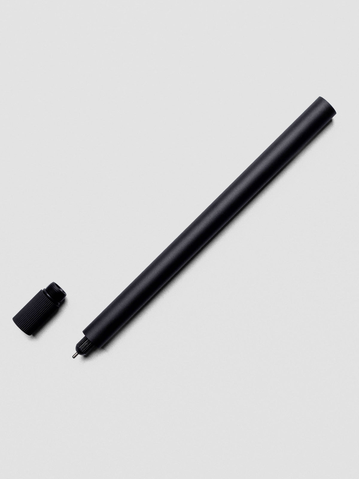 Lumos Pro Single Tip Pen in Matte Black uncapped with nib exposed.
