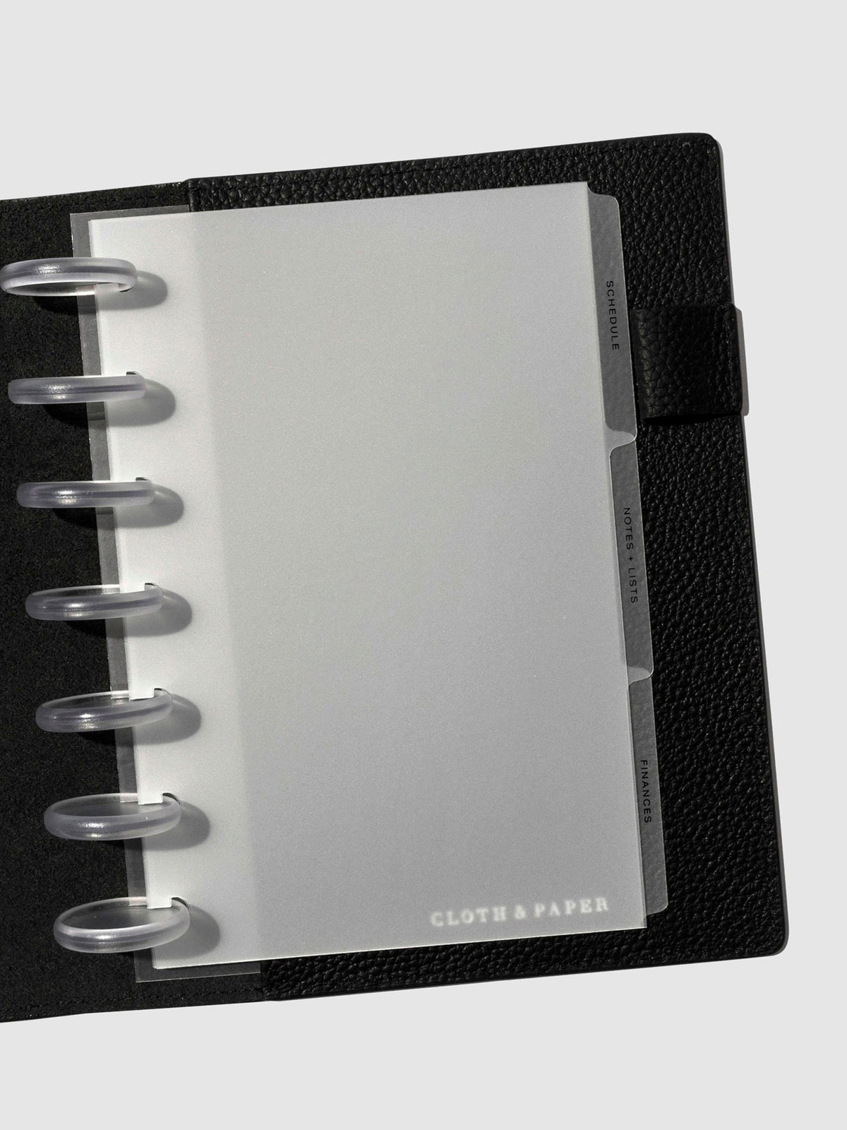 Black foil tabs displayed in use inside a leather folio.
