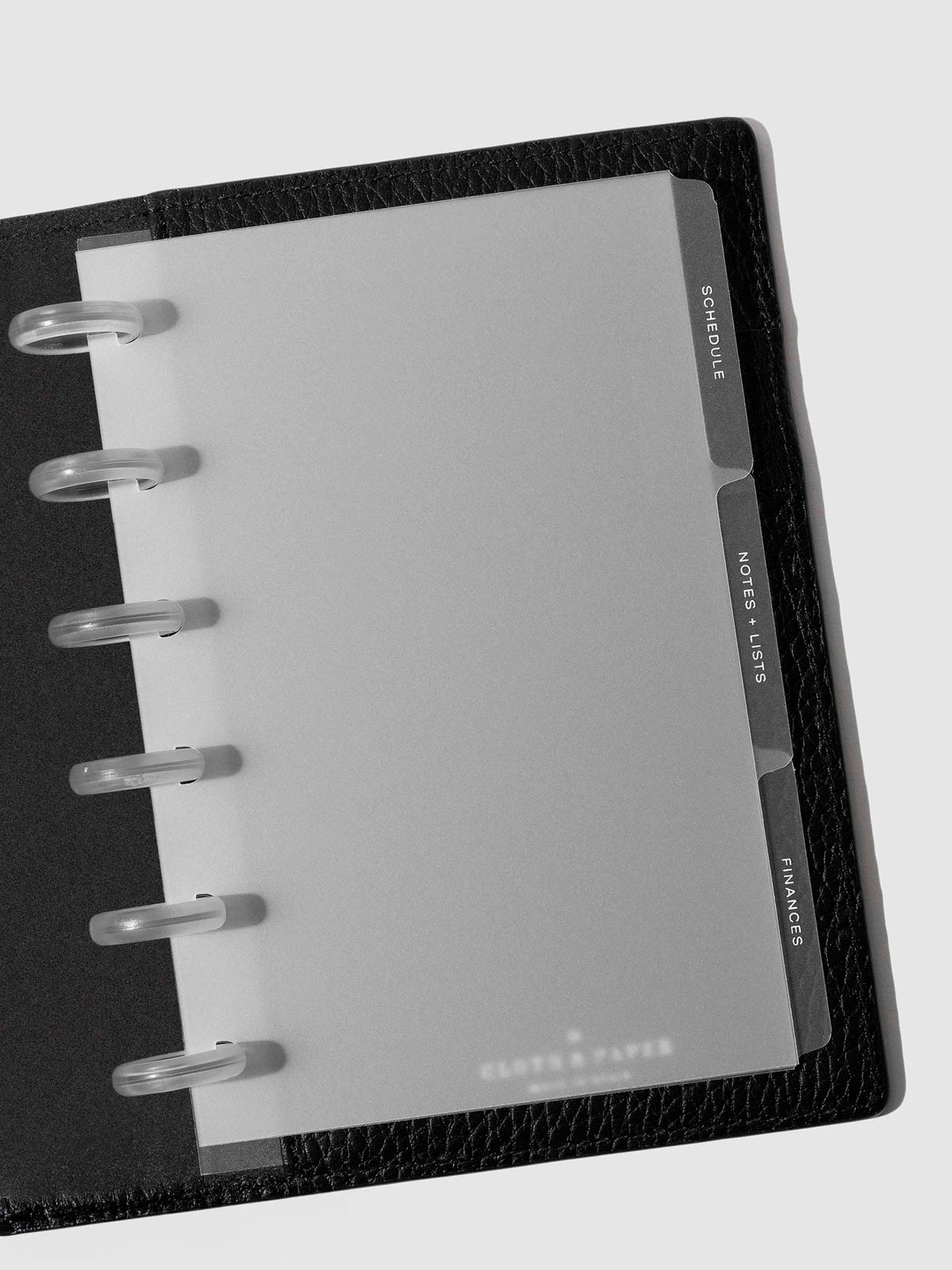 White foil tabs displayed in use inside a leather folio.