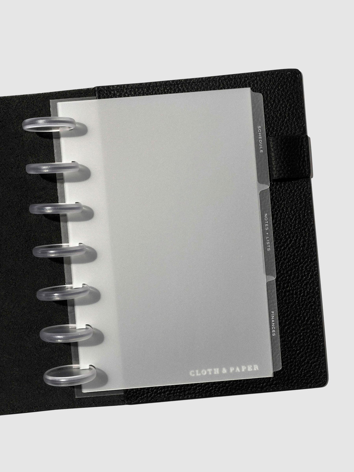 White foil tabs displayed in use inside a leather folio.