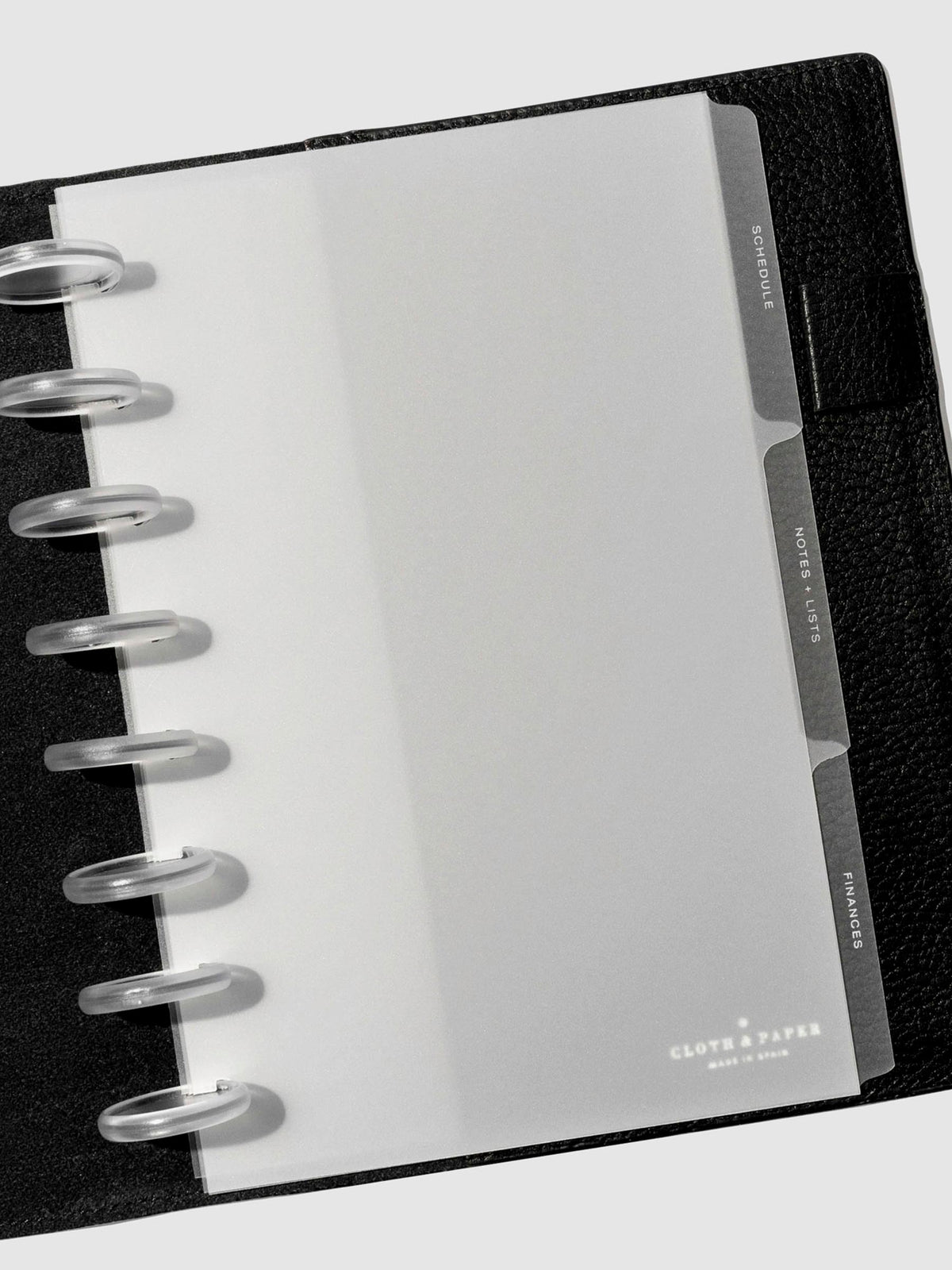 White foil tabs displayed in use inside a leather folio.