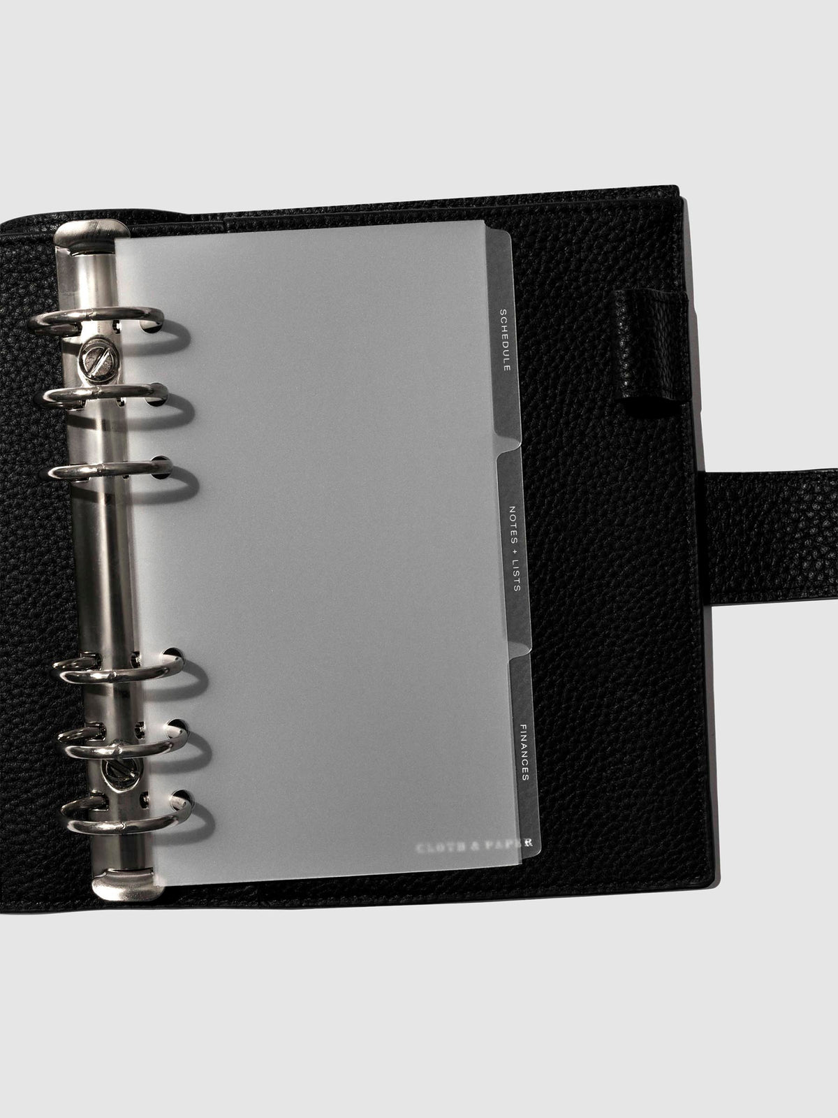 White foil tabs displayed in use inside a leather folio.