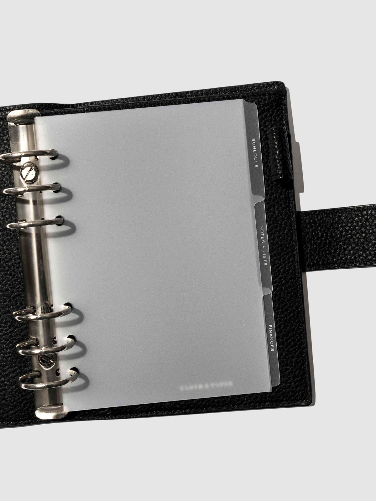 White foil tabs displayed in use inside a leather folio.