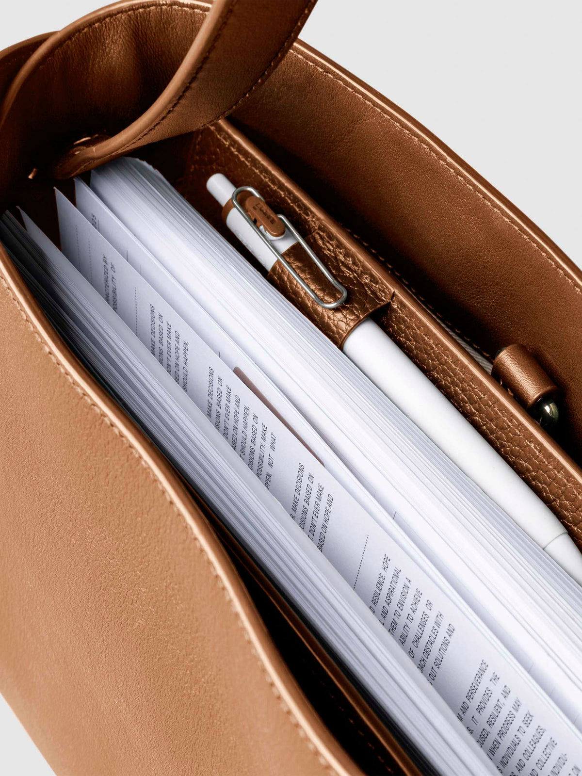 Bag shown from above with a planner inside of it. Color shown is Alhambra.