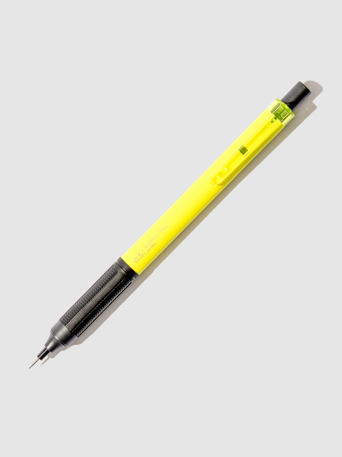 Neon yellow pencil displayed on a neutral background.