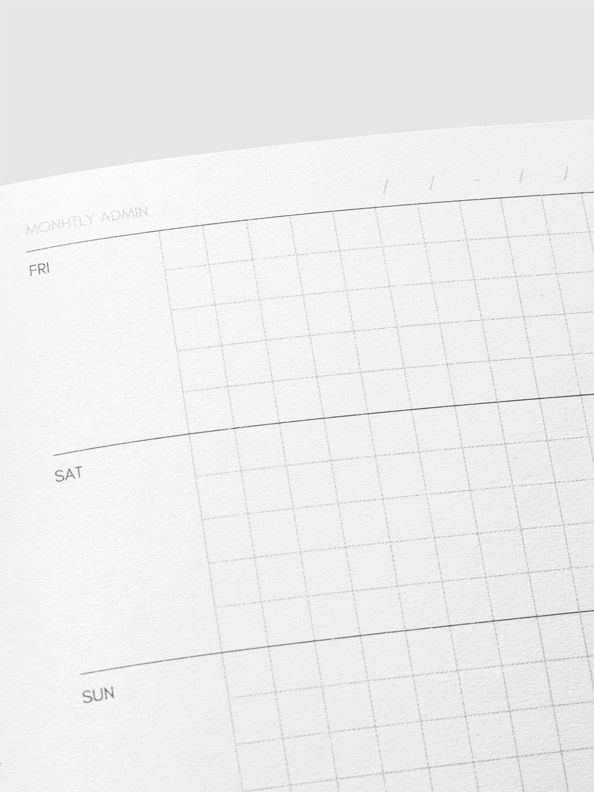 Close up image of the top right of the Weekly Admin Pocket Plus notebook page. The page is displayed on a neutral background.