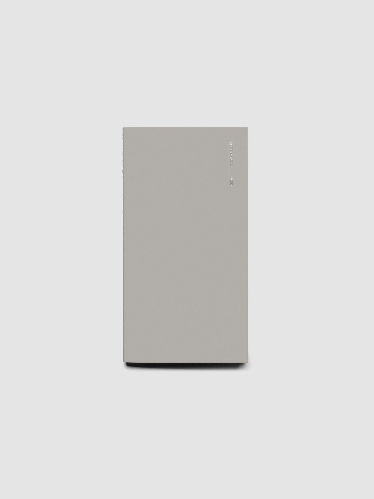 Travel Notebook in size Pocket Plus in the color Ash (grey) containing lined notes layouts shown closed from the front.