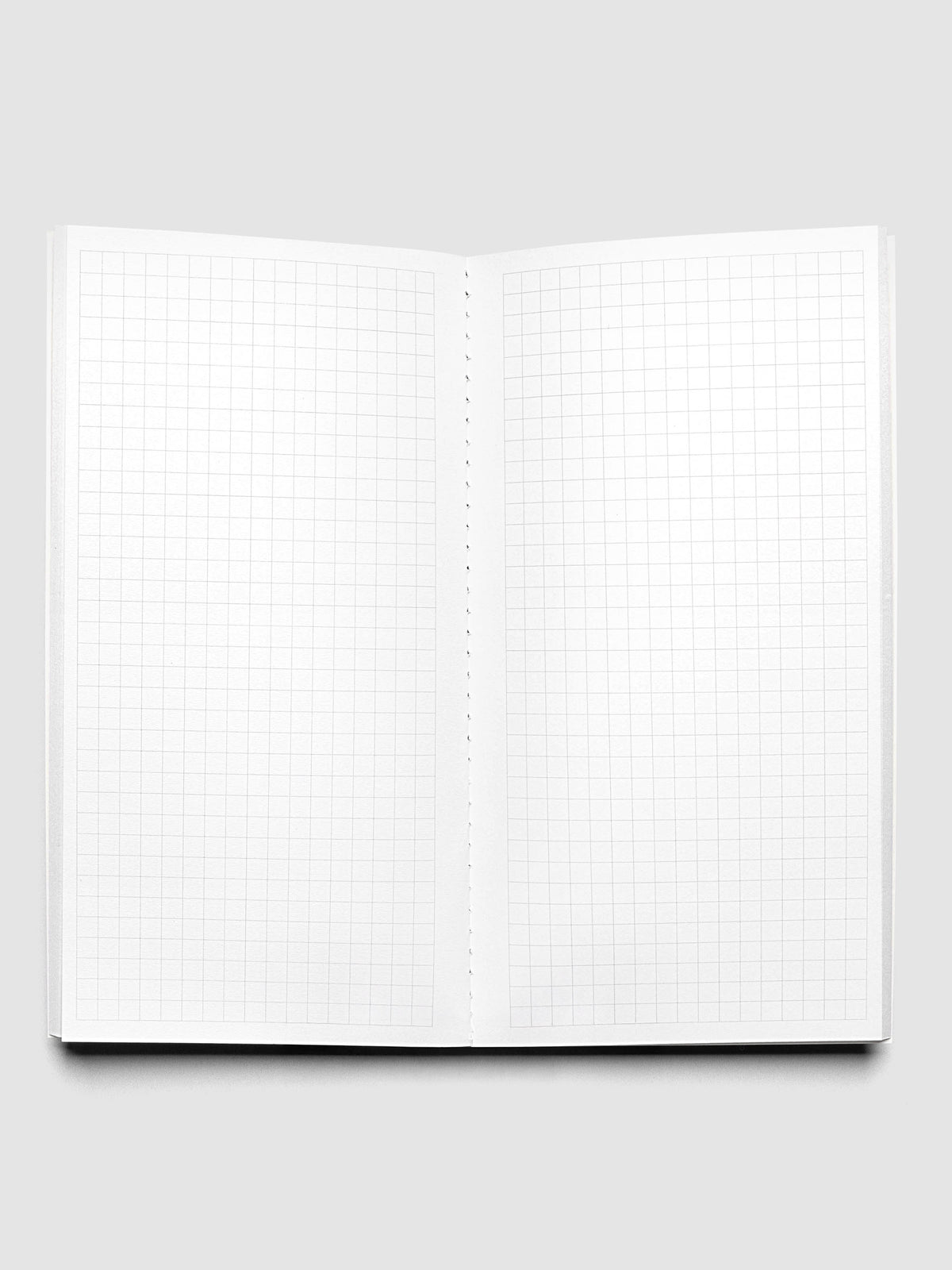 Travel Notebook | Pocket Plus with Graph Note page layouts in Olive green, showing the open notebook pages with graph lined pages.