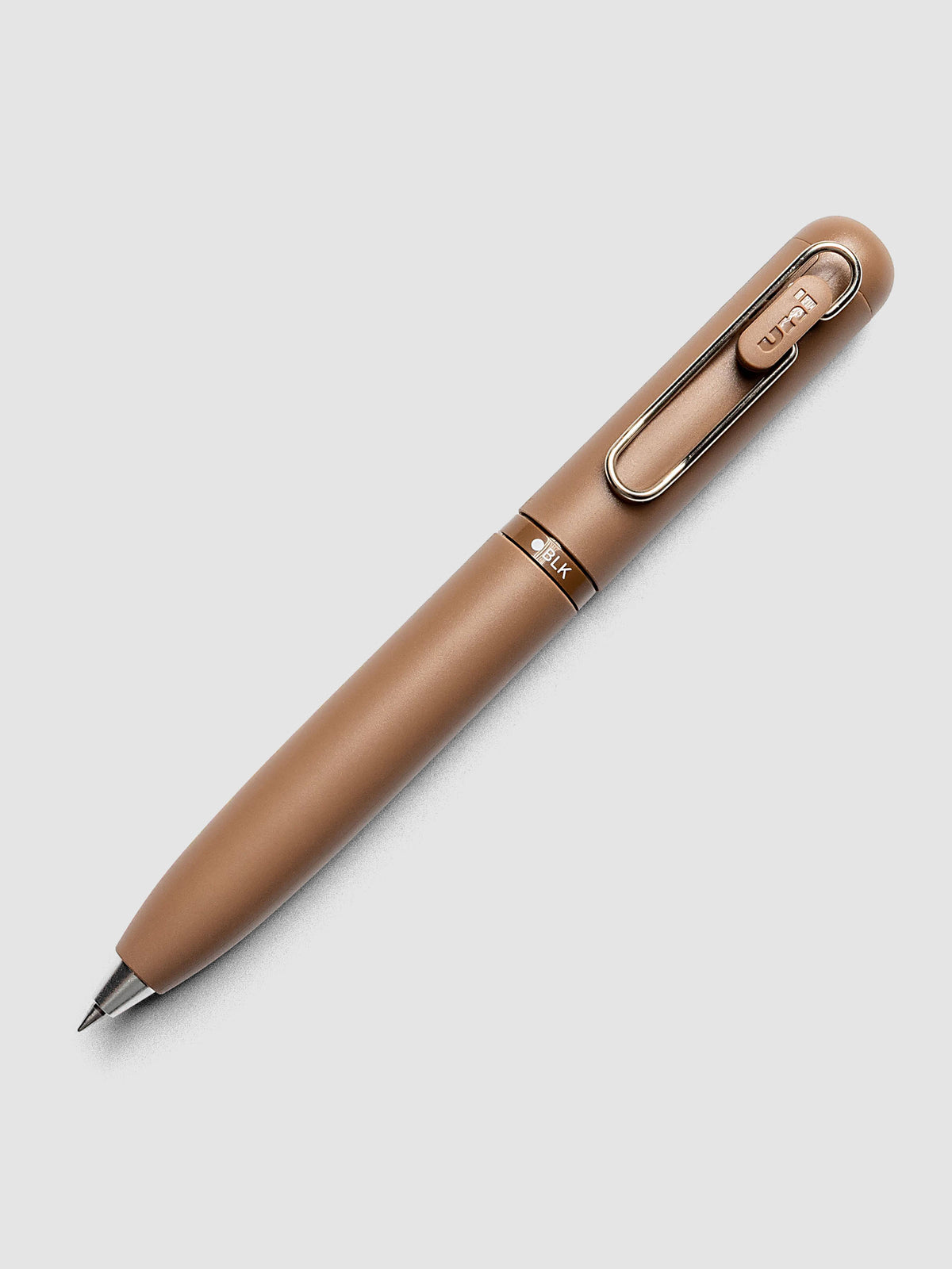 Uni-ball One 3-Color Ballpoint Pen in brown laid diagonally showing clip and BLK color indicator