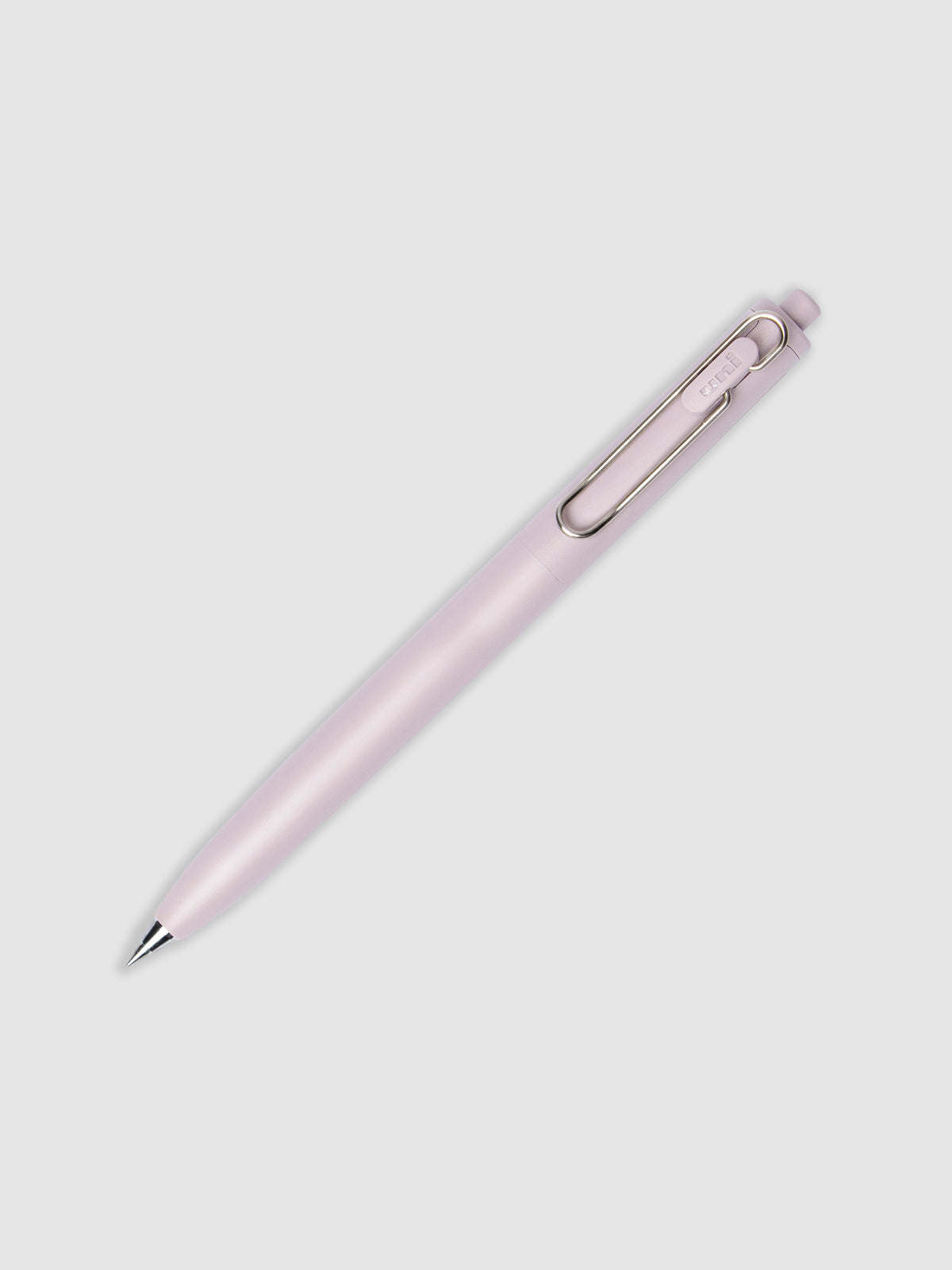 Pink pen turned to the right against a neutral background.
