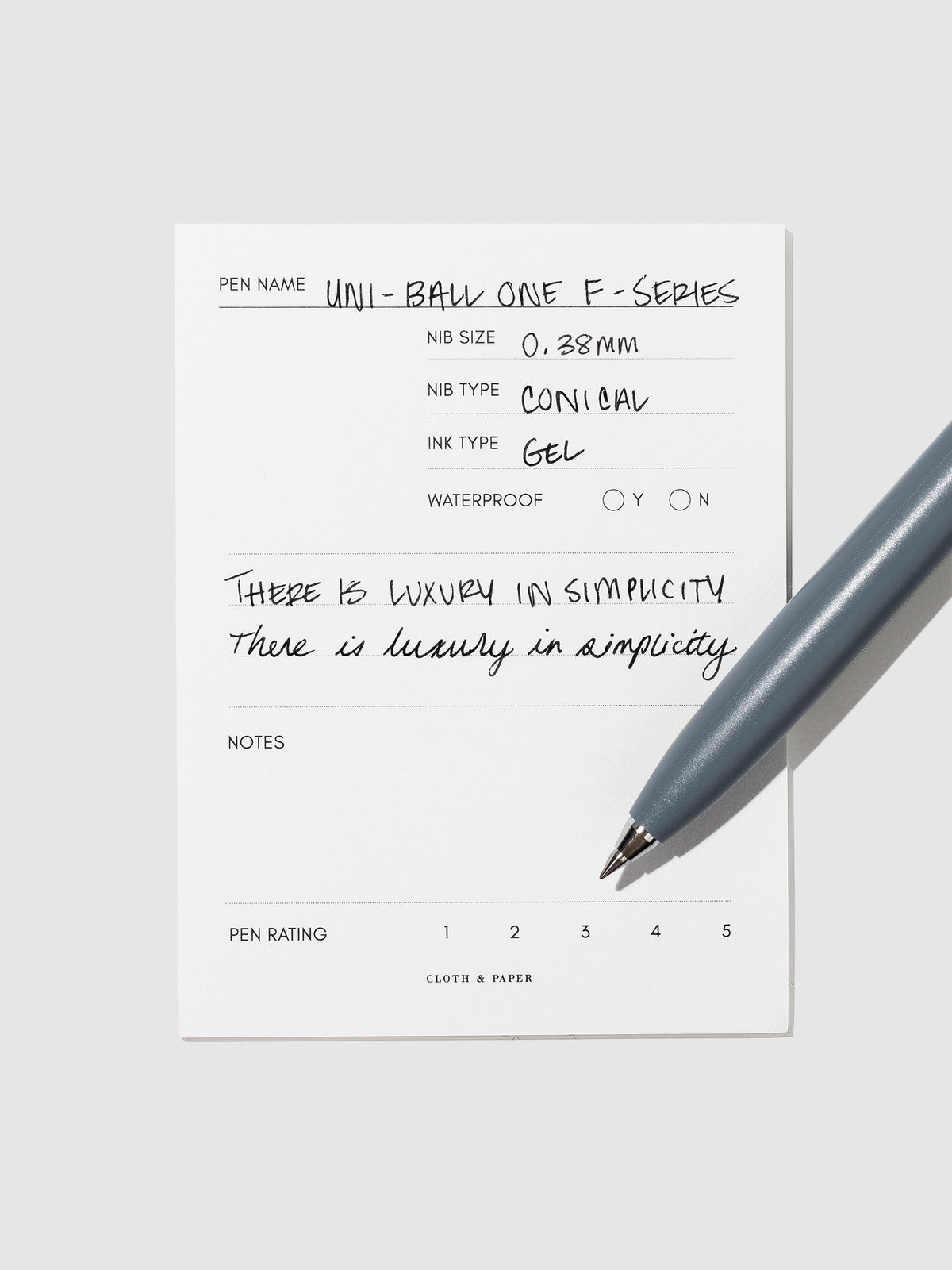 Saxe Blue pen resting on an in use pen test sheet.