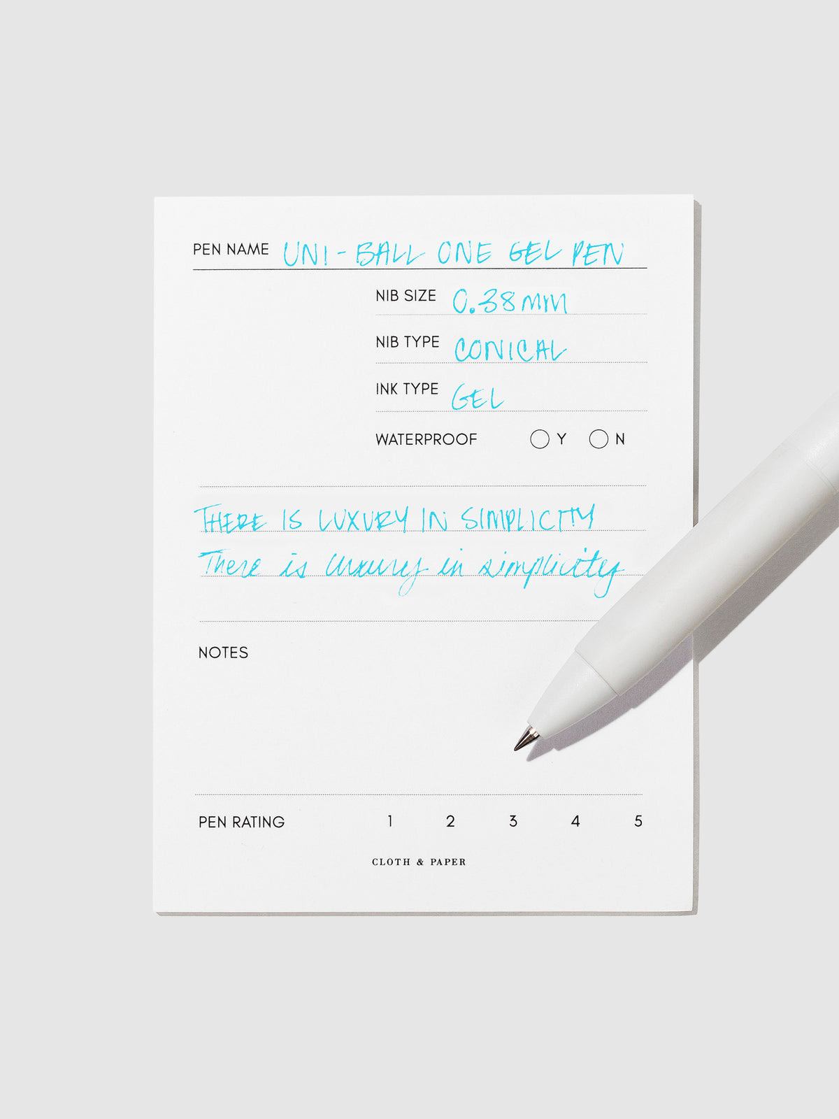 Pen tilted slightly to the right on a neutral background. Color pictured is Sunny Day Blue.