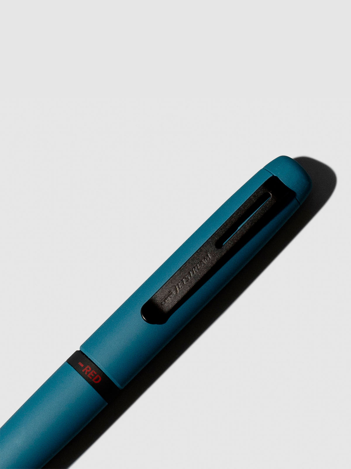 Pen shown close up, with the color selecting ring in focus. Pen ink color selected is red, pen body is Ivy Green.
