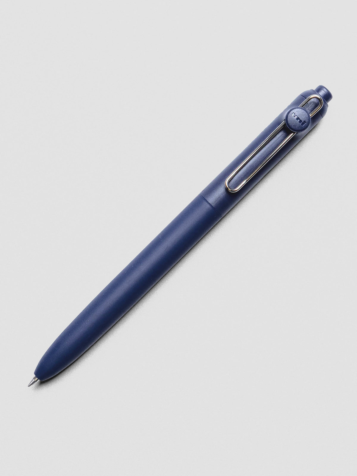 Dark blue pen with a silver clip shown at an angle.