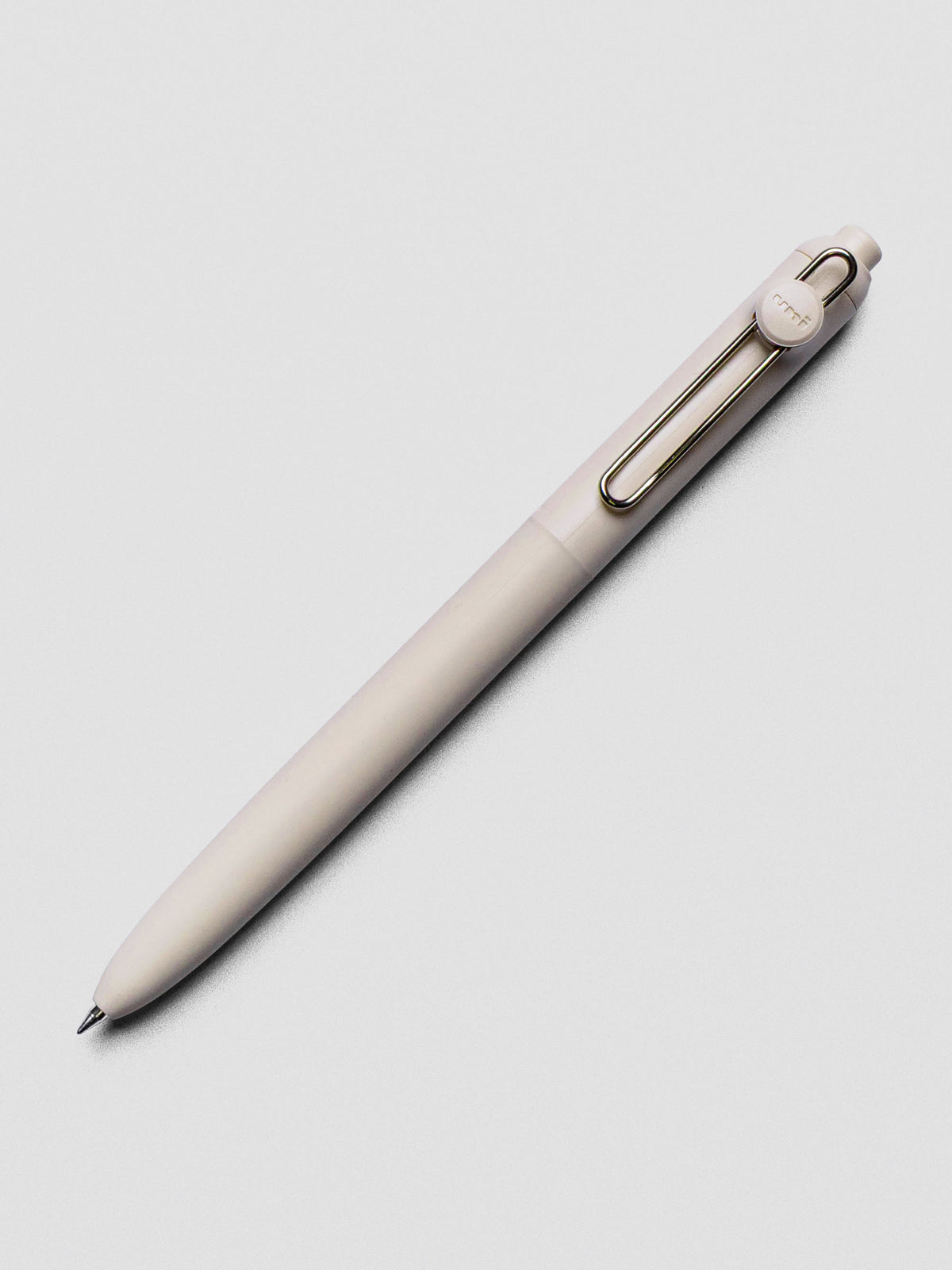 Off-white pen with a silver clip shown at an angle.