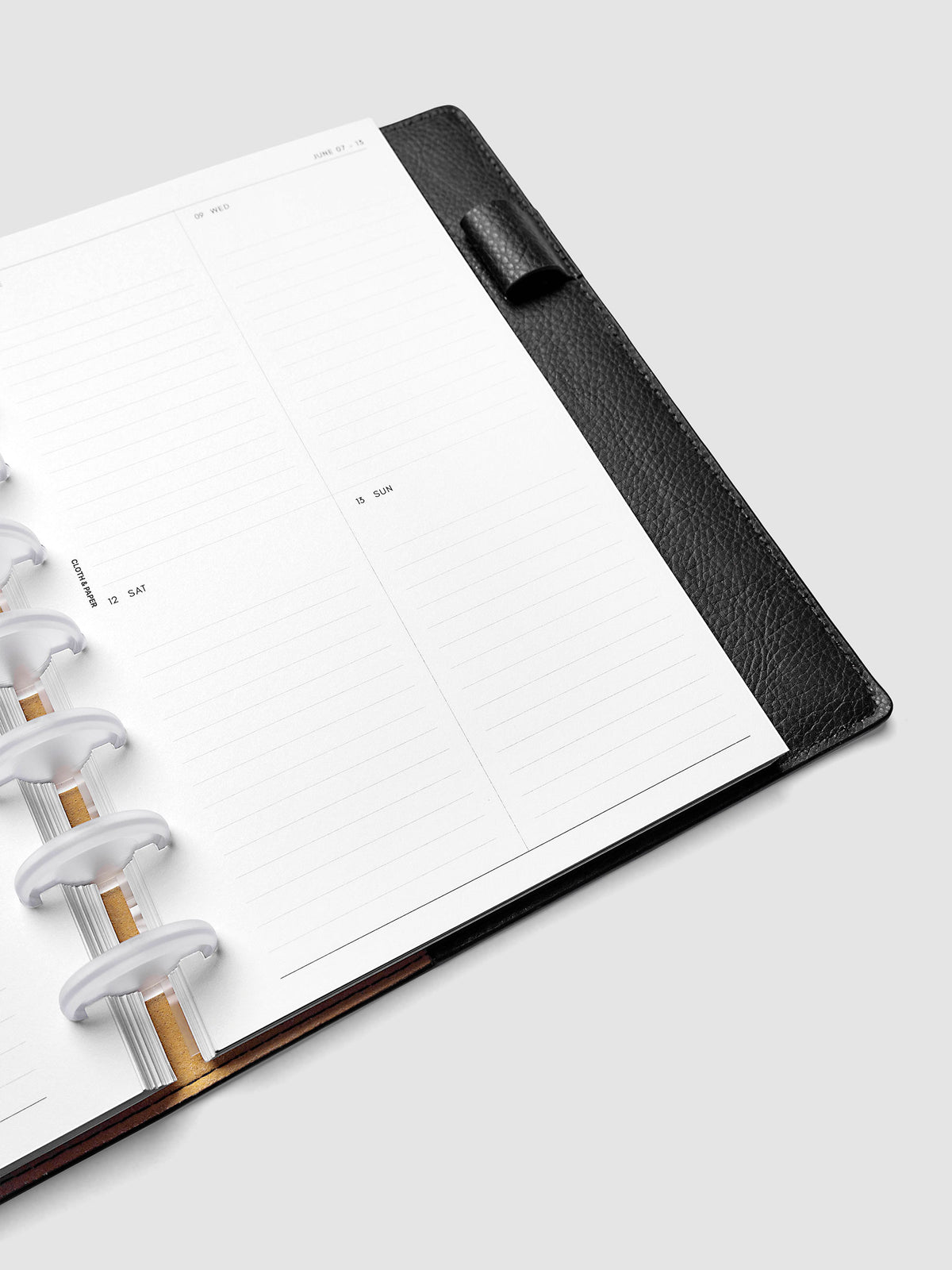 2027 Dated Weekly Vertical Planner Inserts, Monday Start, Half Letter 8-Disc Punch, close-up of the bottom of the right page showing the lower daily grid sections with lined areas for notes and appointments